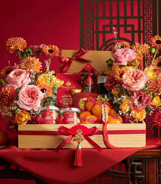 Luxury Chinese New Year gift hamper with gourmet cookies, honey, Charlotte Bakery treats, and fresh mandarins in wooden