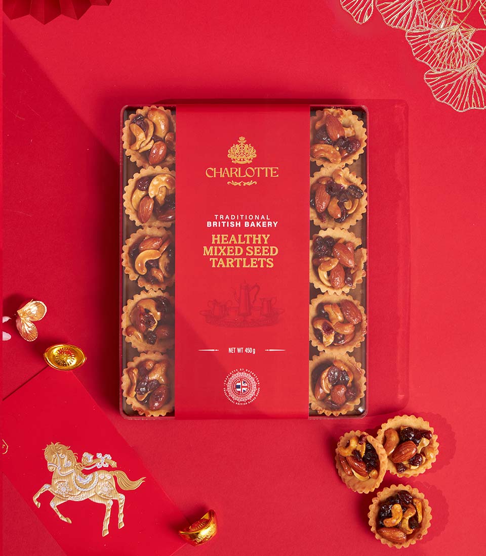Red gift box of artisan mixed seed tartlets with cashews, almonds, and raisins from Charlotte Bakery, Chinese New Year