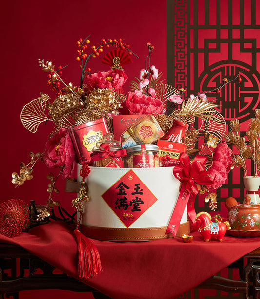 Red and gold Chinese New Year gourmet gift hamper with mandarin cookies, cocoa, tea, peony flowers and gold ornaments