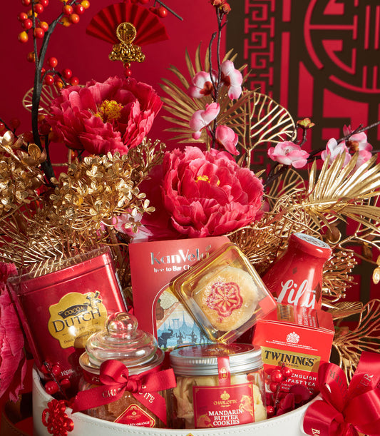 Luxury red and gold Chinese New Year gift basket with premium gourmet treats, artisan flowers, and festive ribbons