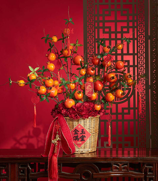 Basketeer premium hamper for Chinese New Year. Pomegranate branch arrangement with red hydrangeas in a wicker basket with decorative tassels. A luxurious gift.