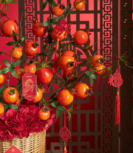 Basketeer's premium Chinese New Year gift: Decorative pomegranate branches, red hydrangeas, and festive ornaments in a wicker basket. Perfect hamper delivery Thailand.