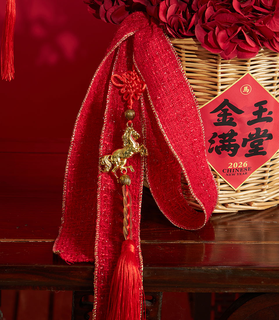 Basketeer luxury gift featuring red hydrangeas in a wicker basket, adorned with a horse charm and red & gold ribbon, perfect for Chinese New Year in Bangkok.