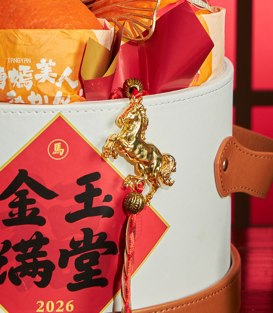 Ehime Orange Chinese New Year prosperity basket with golden horse charm, festive red diamond decoration, and gourmet wrapped