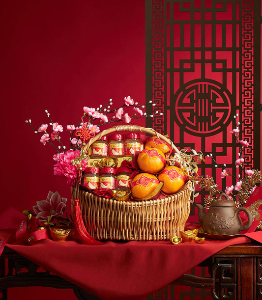 Luxury mandarin oranges and bird's nest gift basket with traditional Chinese New Year décor and festive red styling