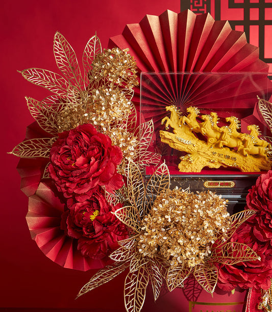 Basketeer premium hamper delivery Thailand: Chinese New Year gift featuring a golden eight horses sculpture, red florals, and golden accents. A luxurious corporate gift.