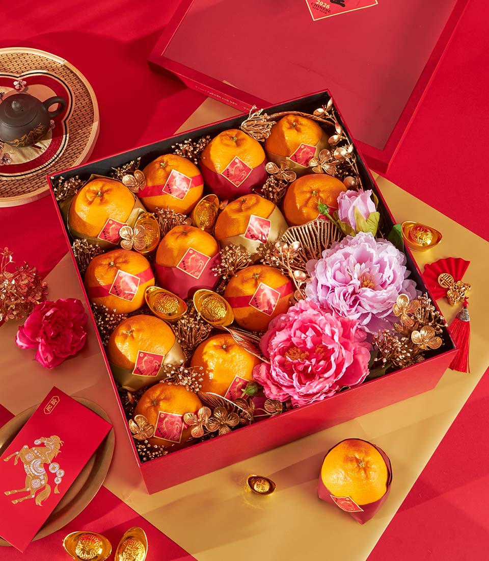 Luxury Chinese New Year gift box with Dekopon oranges, peonies, gold accents, and traditional prosperity symbols