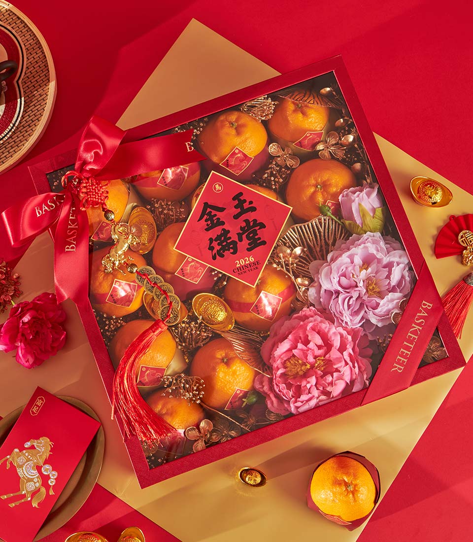 Red luxury gift box with Dekopon oranges, peonies, and gold ingots for Chinese New Year