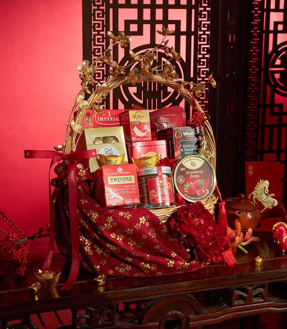 Golden Fortune gourmet gift basket with tea, chocolates, and premium treats in red and gold packaging for Chinese New Year