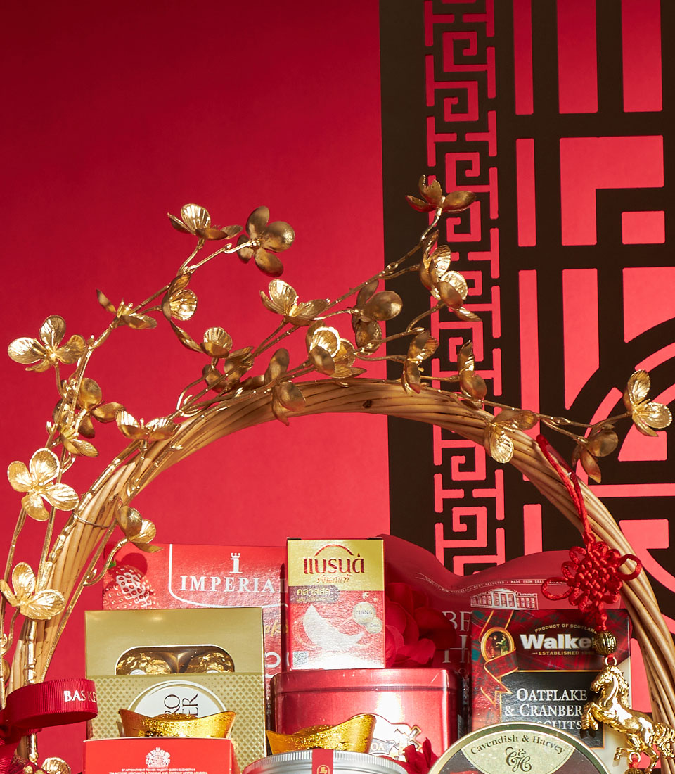 Golden Fortune gourmet gift basket with red and gold packaging, wicker handle, and festive Chinese New Year charms on