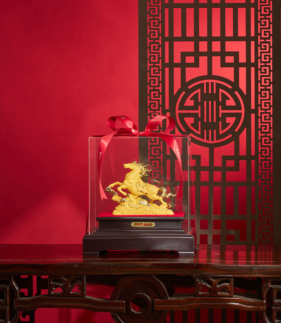Golden horse sculpture with gemstone details in acrylic display box, Chinese New Year luxury gift