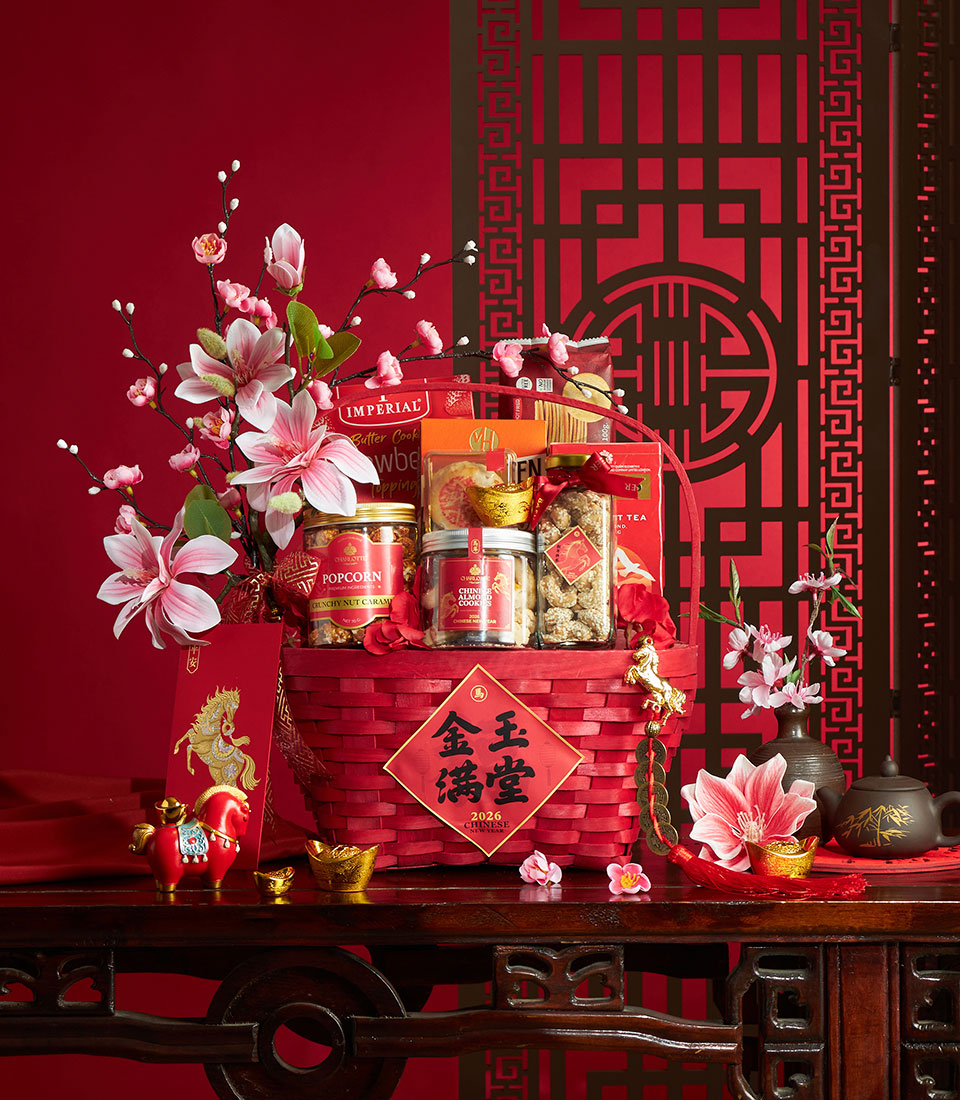 Red luxury gift basket with gourmet snacks, popcorn, almond cookies, and gold accents for Chinese New Year celebrations