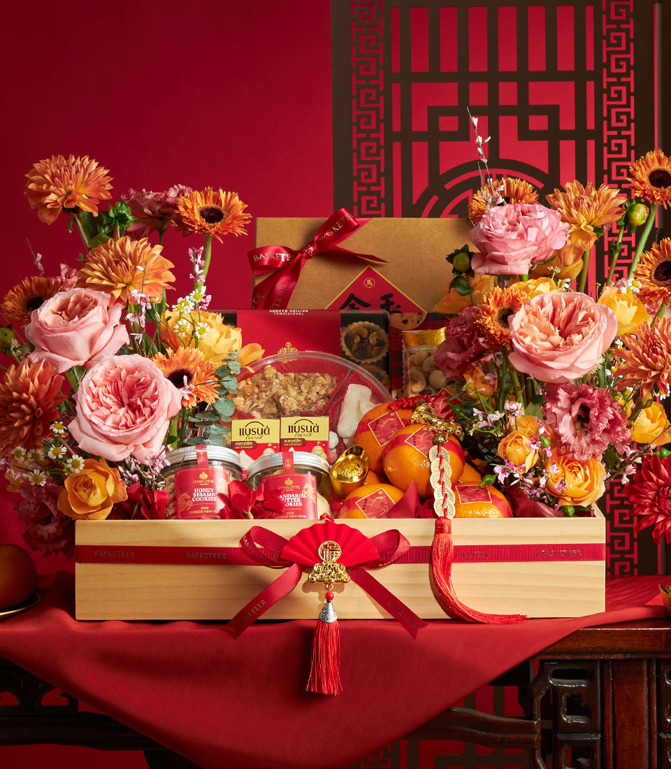 Luxury mandarin orange and gourmet gift basket in wooden crate with red ribbon, sesame and mandarin cookies, nuts, and fresh