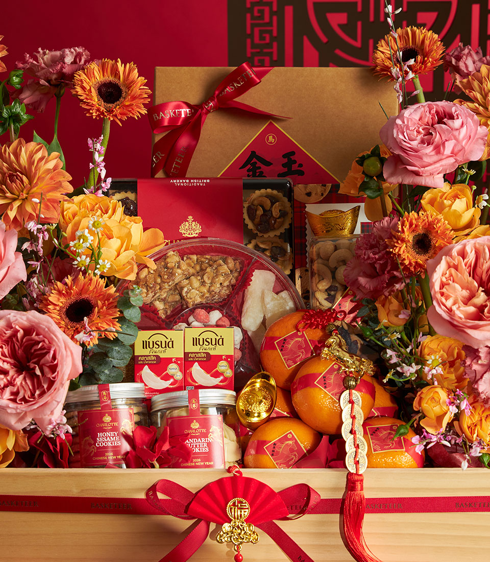 Chinese New Year luxury gift hamper with fresh flowers, mandarin oranges, honey sesame cookies, bird's nest drink, and