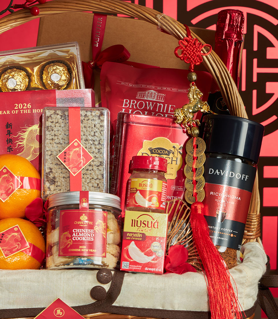 Festive red and gold Chinese New Year gift basket with gourmet chocolates, coffee, cookies, and lucky oranges