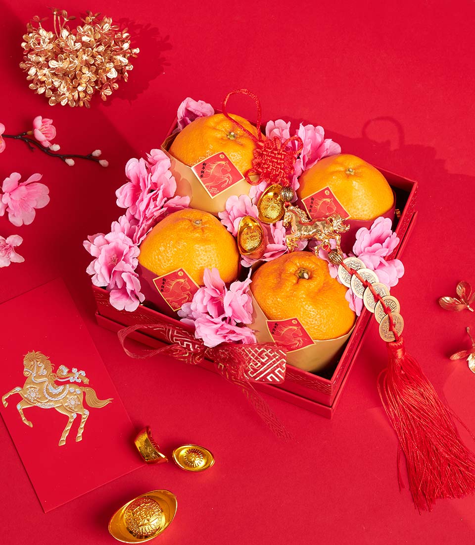 Premium Dekopon oranges with cherry blossoms, gold accents, and lucky red ribbon in festive Chinese New Year gift box