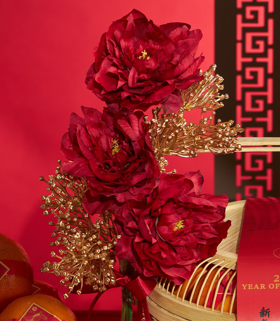 Chinese New Year mandarin orange gift basket with red peonies and golden accents