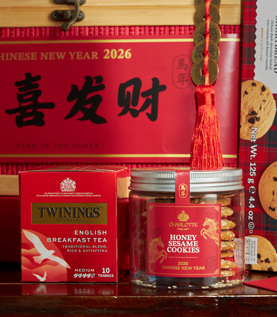 Luxe Chinese New Year gift box with mandarin oranges, English breakfast tea, honey sesame cookies, and shortbread for Year
