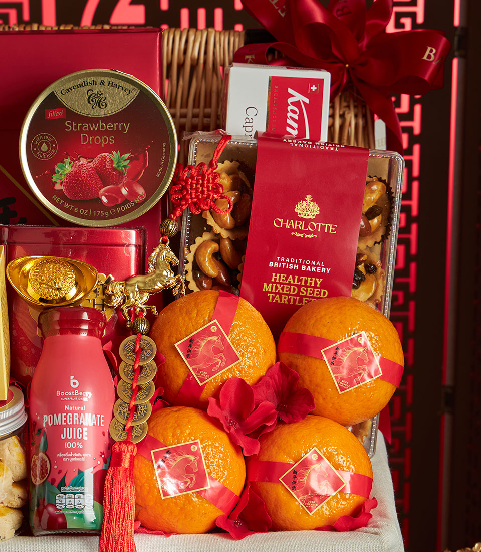 Luxury red and gold Chinese New Year gift basket with premium mandarin oranges, gourmet treats, and festive horse figurines