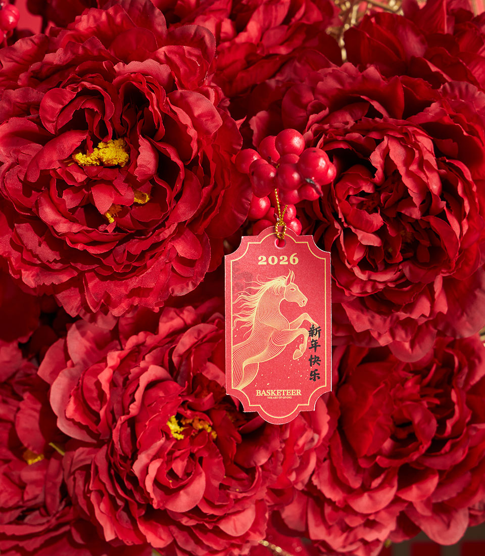 Lush red peony arrangement for a luxury gift basket Bangkok by Basketeer. A premium hamper delivery Thailand for Chinese New Year.
