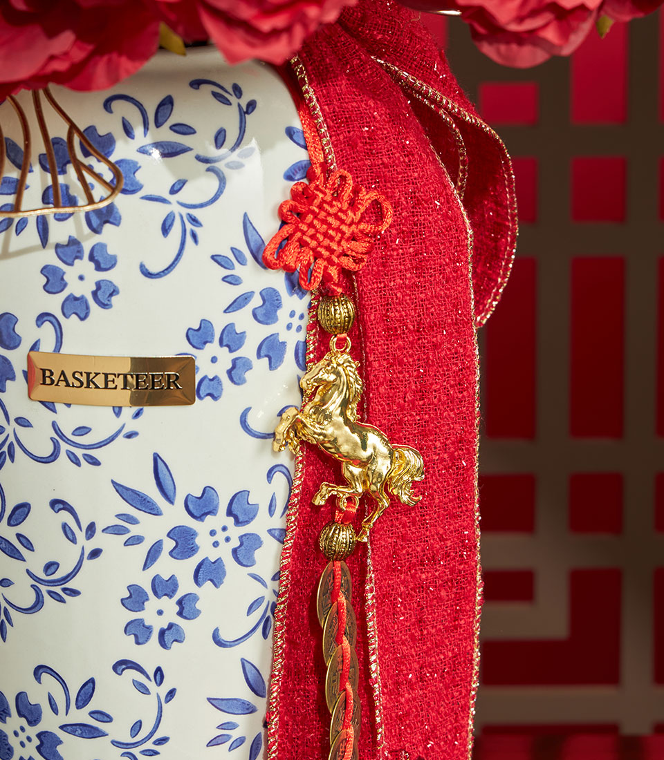 Red peony artificial flowers in ceramic vase with Chinese New Year charm and gold accents
