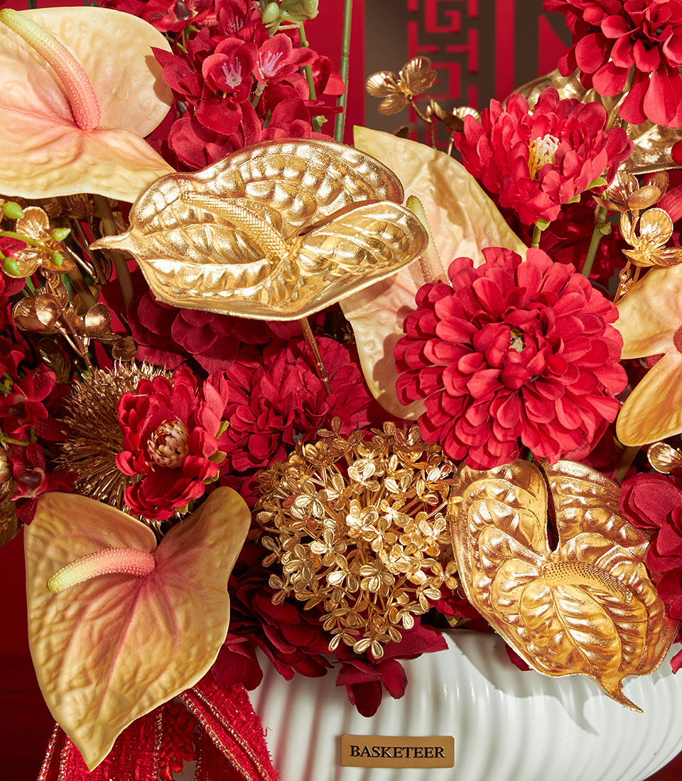 Basketeer premium gift: Red and gold artificial flower arrangement in decorative vase, perfect for Chinese New Year in Bangkok, Thailand.