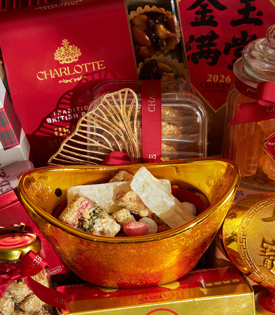 Grand Prosperity Chinese New Year gift basket with golden yuanbao sweets, Charlotte Bakery treats, dried citrus, and