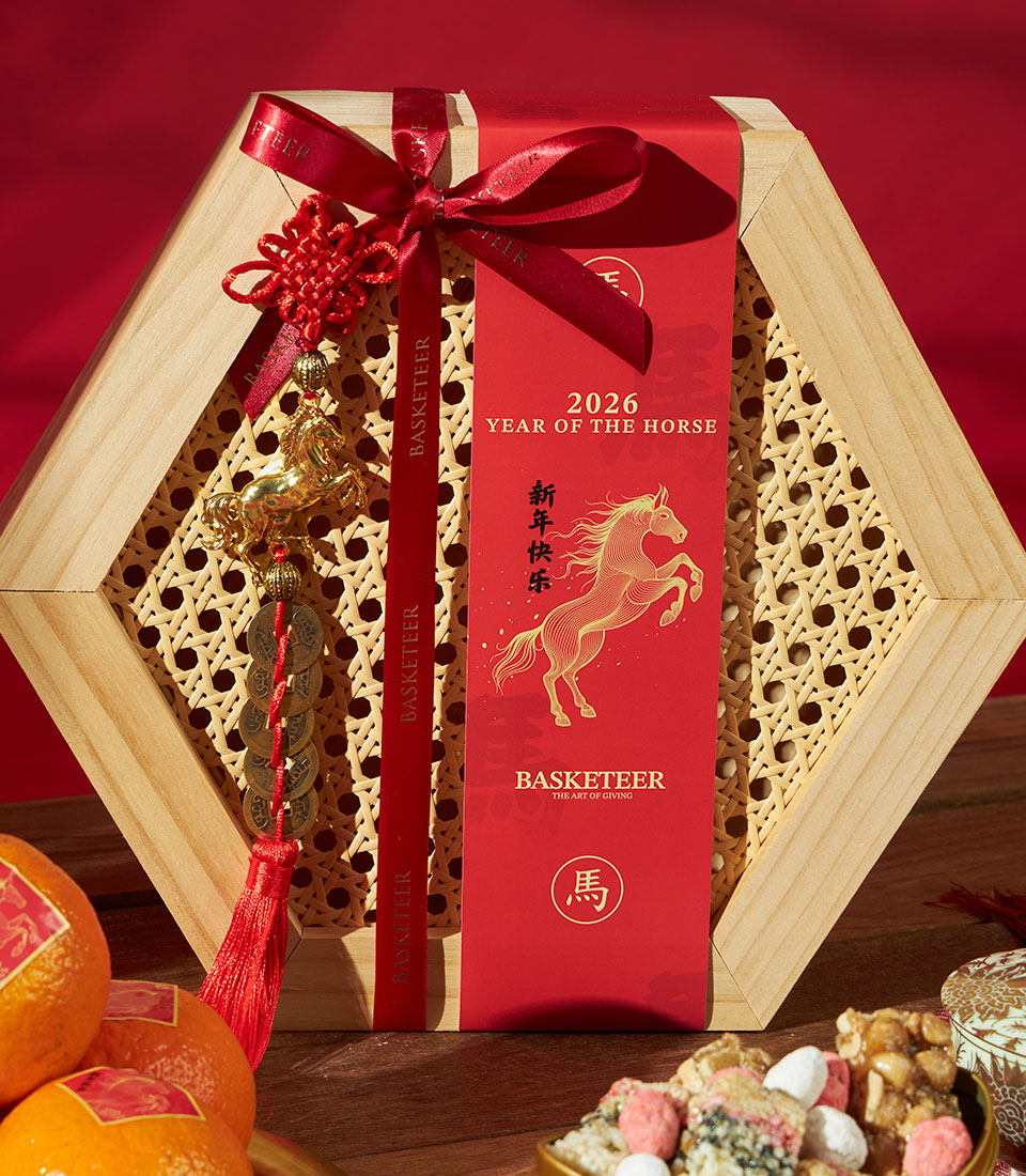 Premium hexagonal gift box with mandarin oranges and festive sweets for Chinese New Year