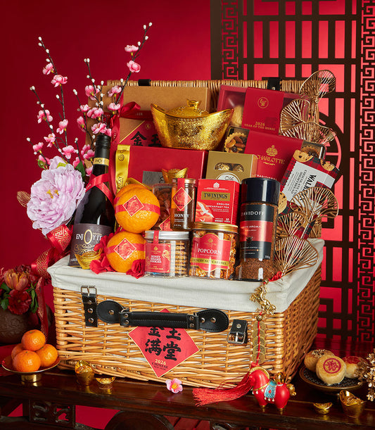 Premium wicker Chinese New Year gift hamper with non-alcoholic wine, honey, tea, coffee, mandarins, peonies, and golden