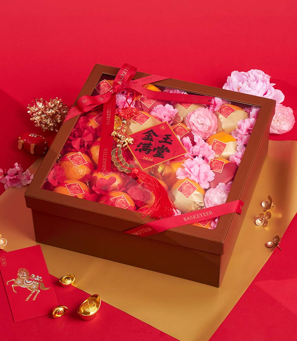 Premium Chinese New Year mandarin orange gift box with red ribbon, fresh citrus, and gold accents