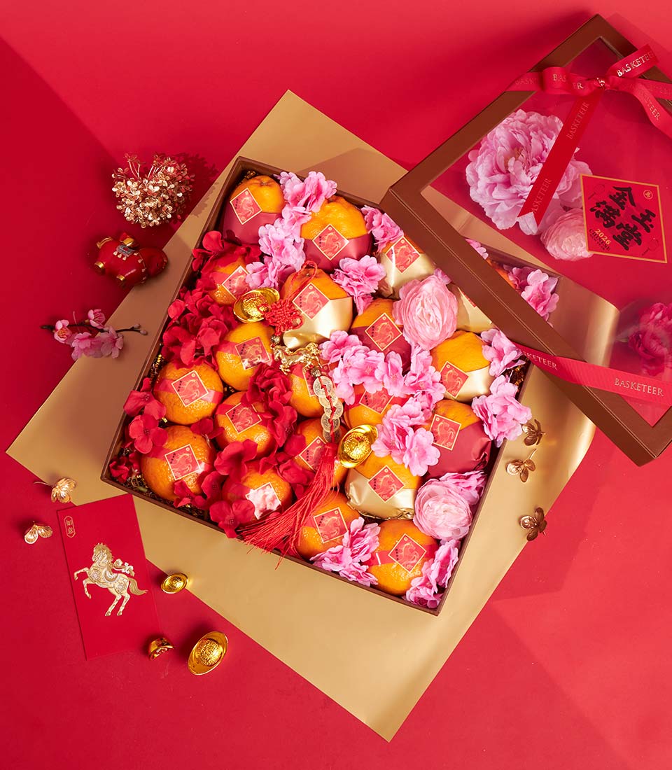 Premium mandarin orange gift box with gold ingots and red silk flowers for Chinese New Year celebration