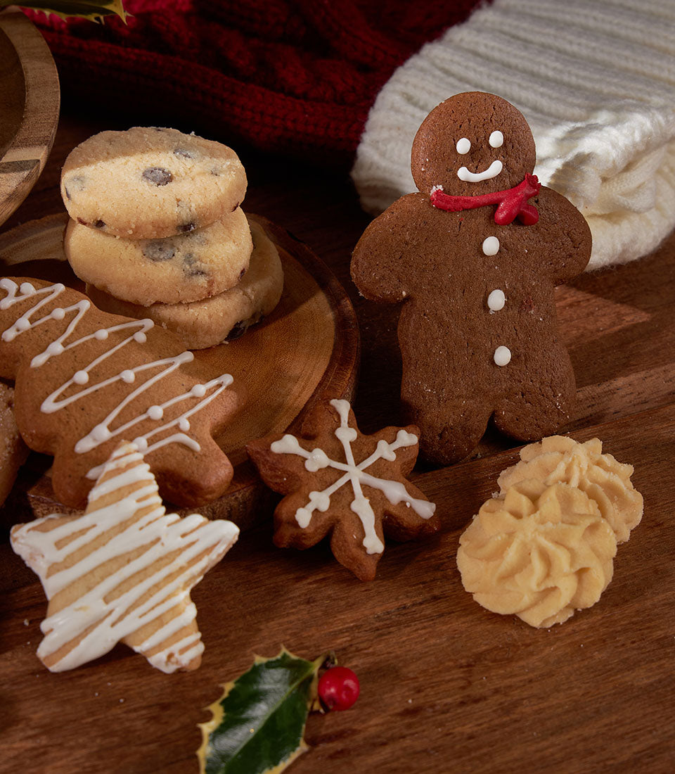 Grandma Amy's Christmas Biscuits with gingerbread, chocolate chip, and butter cookies in festive jar gift