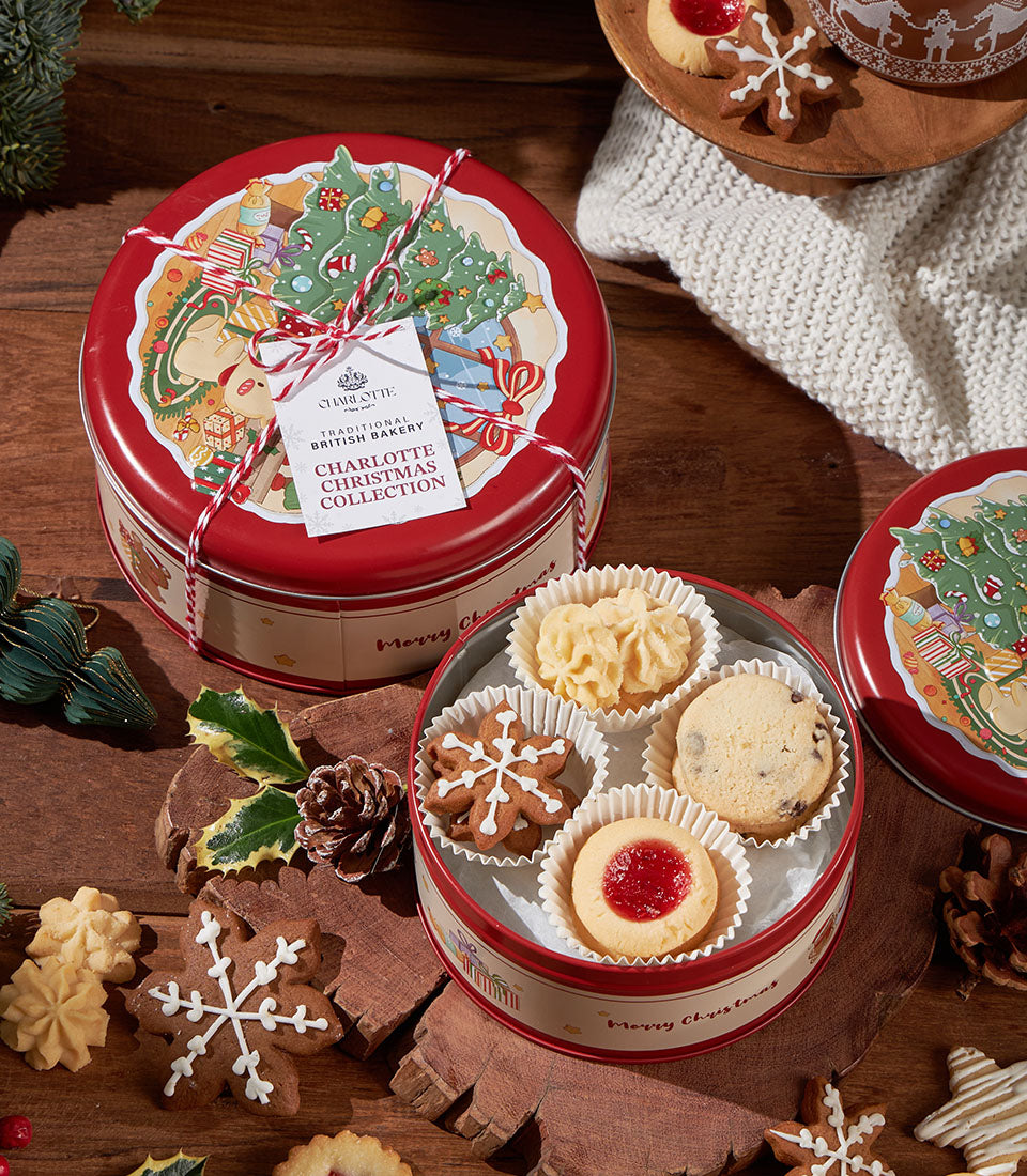 Grandma Amy's Christmas Biscuit Collection festive red tin with assorted traditional British cookies, gingerbread, and