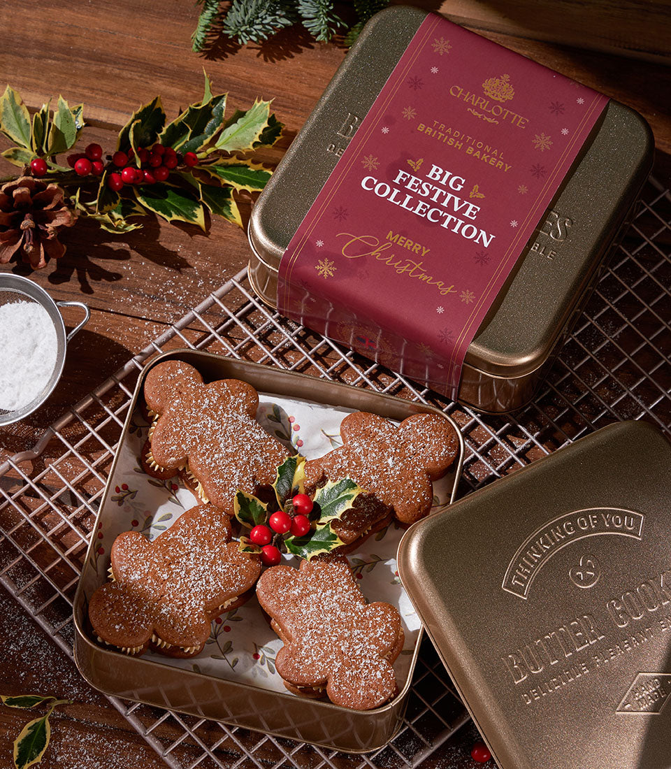 Cream stuffed gingerbread fatties in festive gold tin with powdered sugar, Christmas gift set