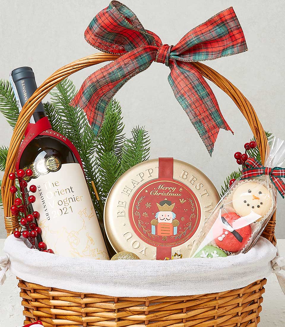 Classic Christmas wine basket with award-winning Voignier, festive macarons, and holiday treats in woven wicker