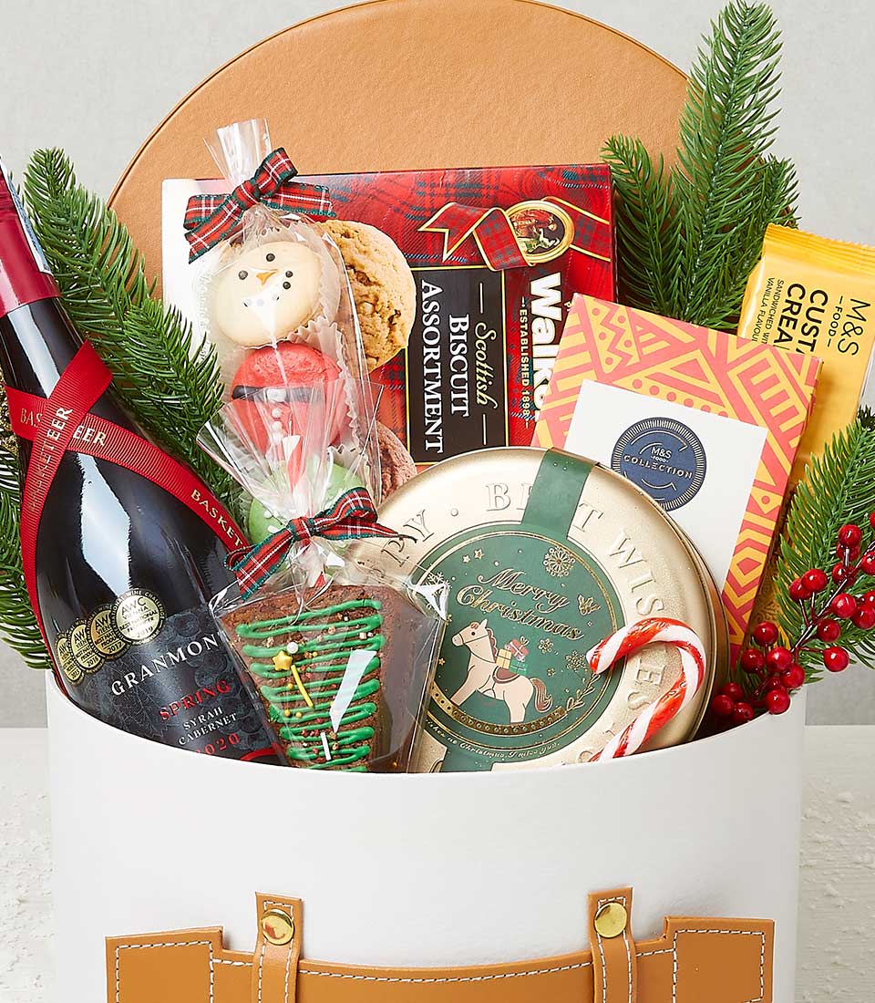 Holiday Cheer Gift Box with award-winning Syrah Cabernet wine, Scottish biscuits, and festive treats in white cylindrical