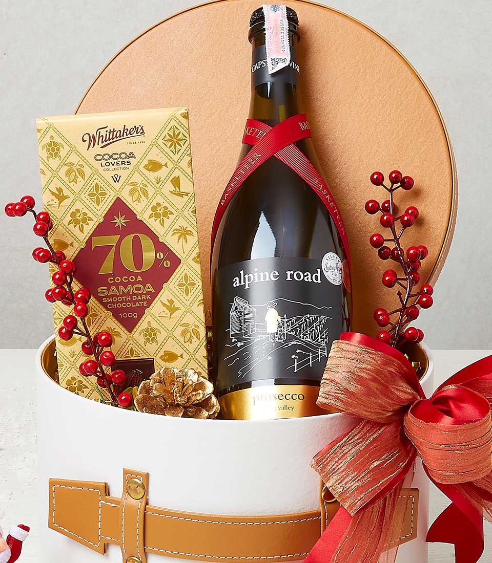 Festive wine and dark chocolate gift hamper with prosecco, 70% cocoa bar, and red gold bow in white round box