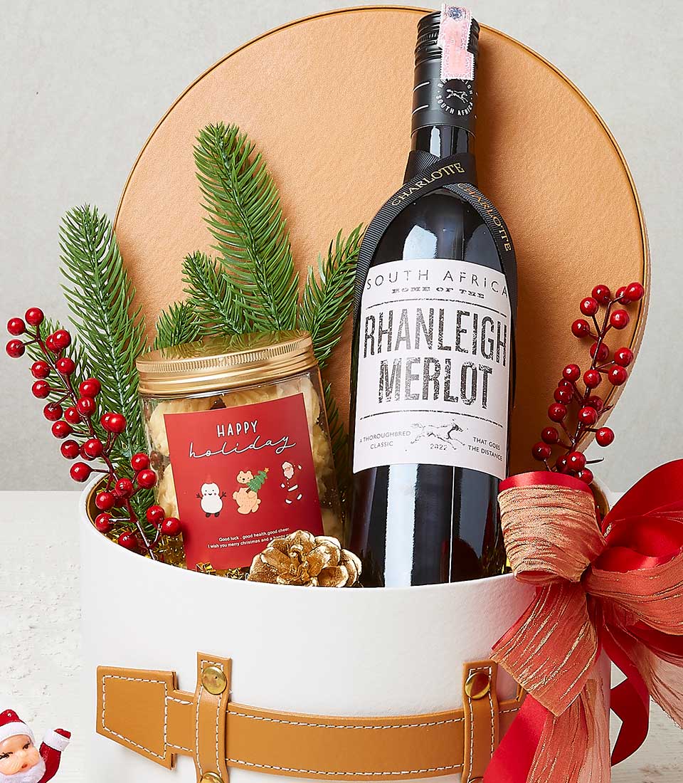 Rhanleigh Merlot wine and artisan cookies gift box with festive holiday decoration and gold-trimmed packaging