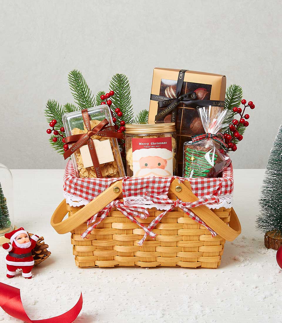 Festive woven Christmas hamper with gourmet treats, red gingham liner, and holiday decorations
