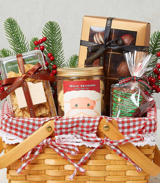 Festive Christmas gourmet hamper with almond florentines, shortbread, chocolates, and tree-shaped brownie in woven basket