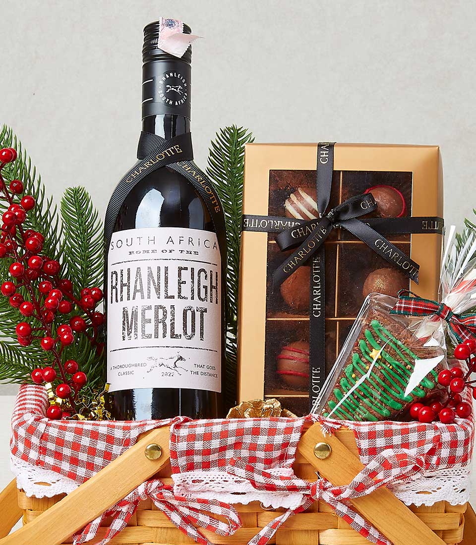 Premium Yuletide gift basket with South African Merlot, artisan chocolates, and festive cookie in wicker with holiday styling