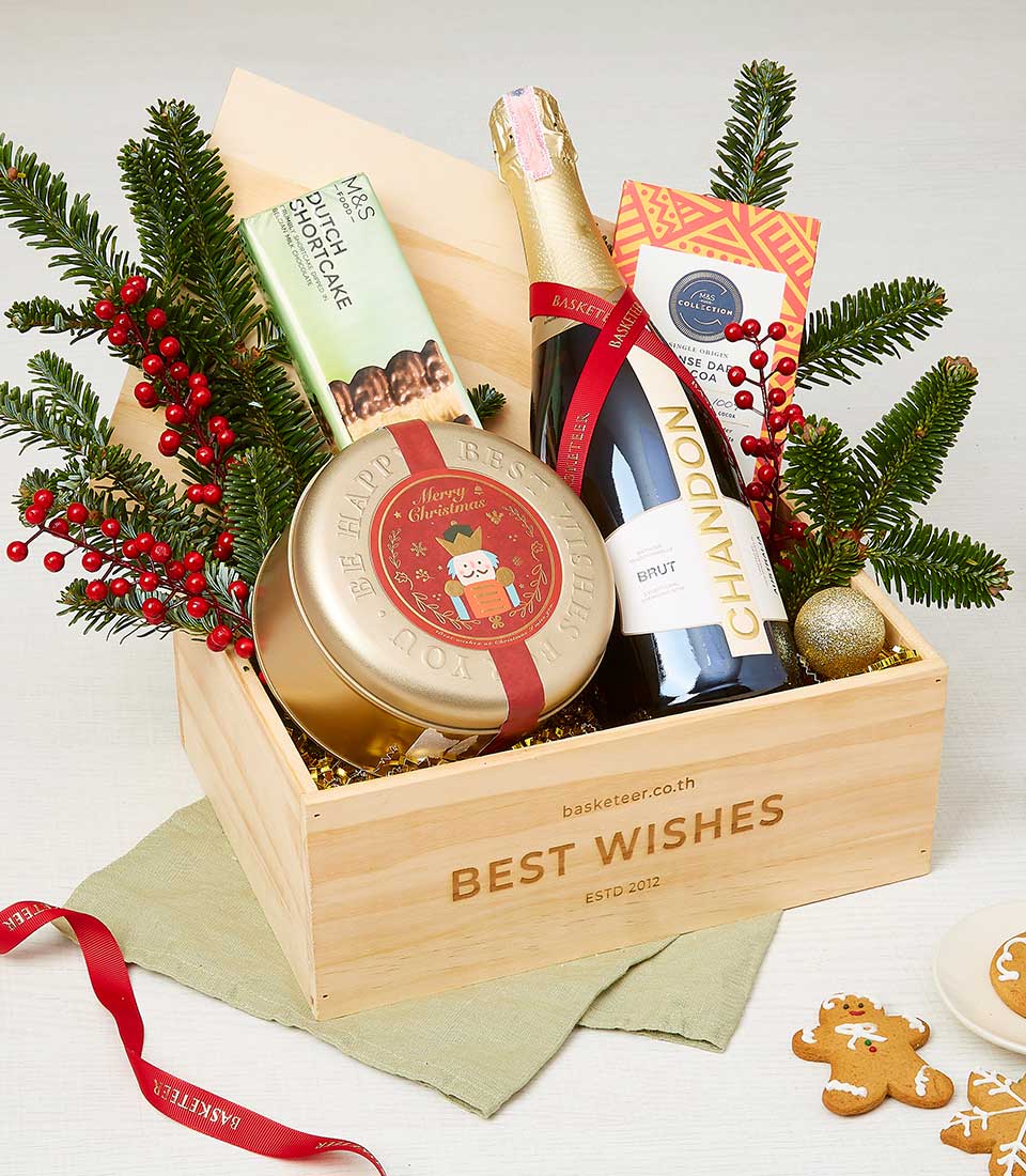 Luxury Christmas wine gift basket with Chandon champagne, Dutch shortcake, gold nutcracker tin, and festive greenery in