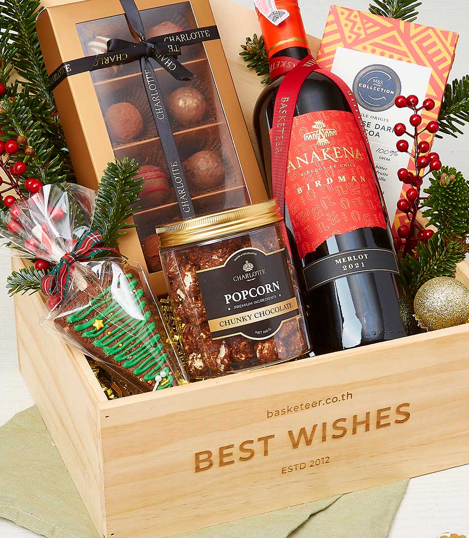 Deluxe Christmas wine hamper with red Merlot, luxury chocolates, popcorn and festive treats in wooden crate
