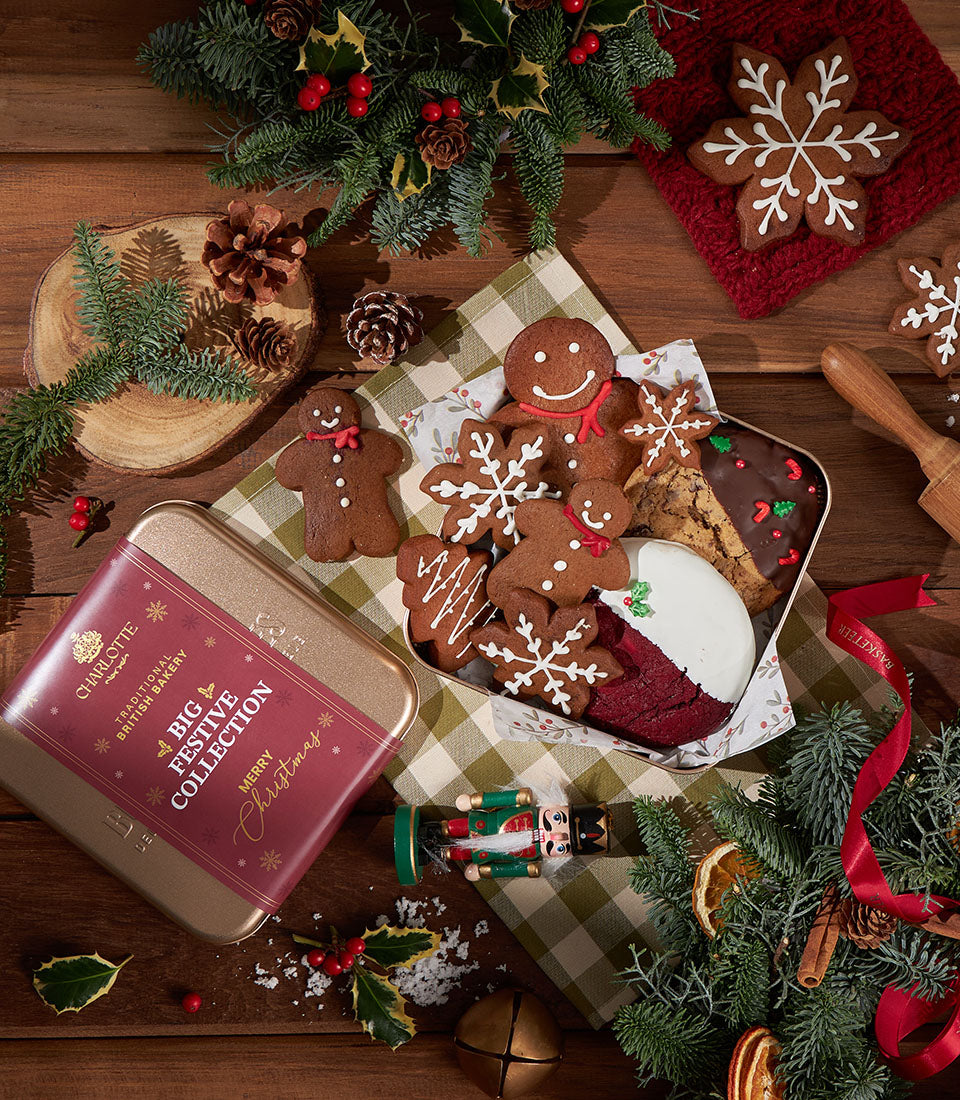 Festive Christmas baked goods collection with gingerbread cookies, chocolate-dipped treats, and holiday decorations in gold