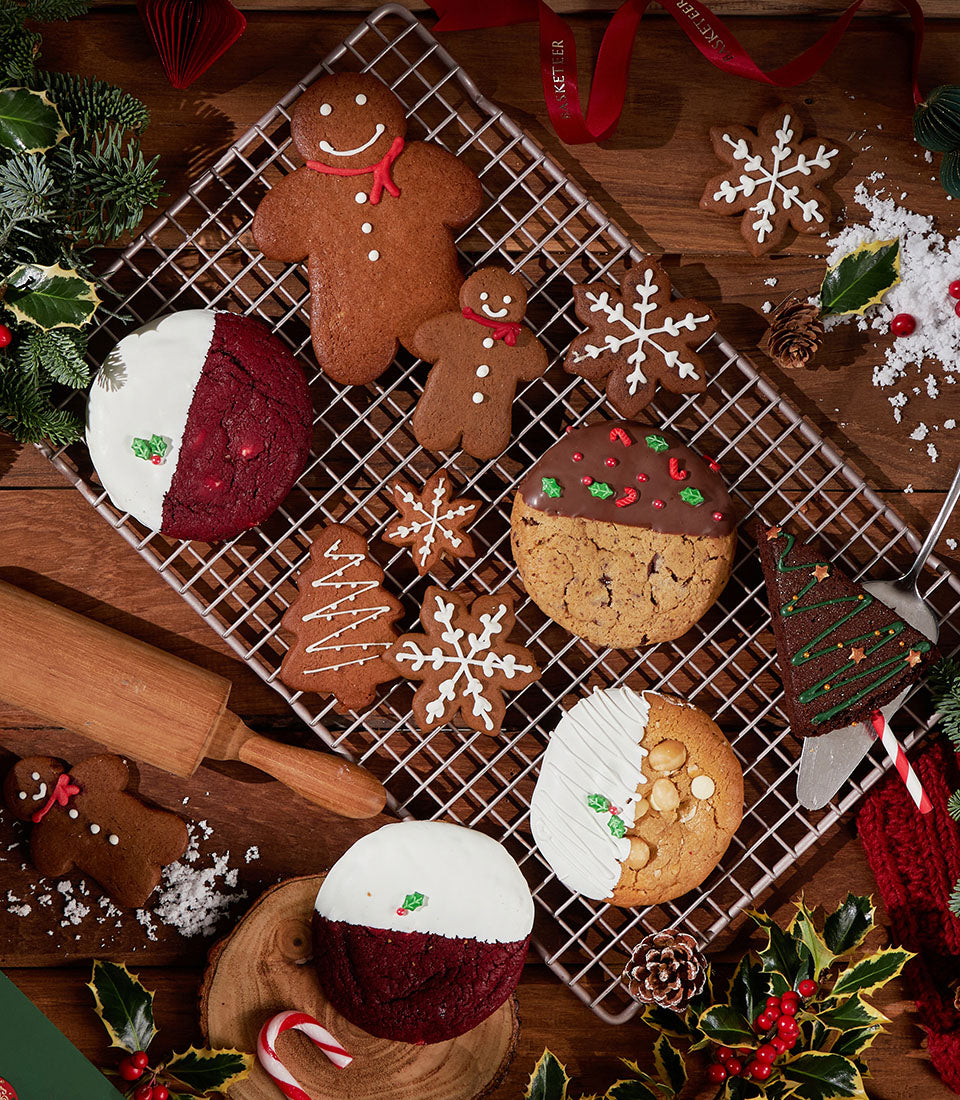 Festive Christmas bakes with gingerbread, red velvet, and decorated cookies on cooling rack