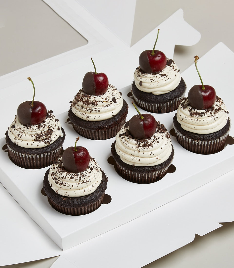 Dark cherry and chocolate dipped cupcakes in white gift box, artisan bakery treats for gifting