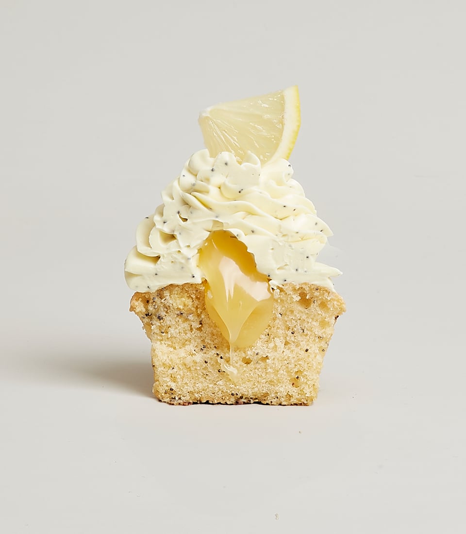 Lemon poppy seed cupcake with creamy frosting and bright lemon curd filling, artisan bakery gift