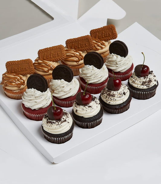 Dozen gourmet cupcakes in white gift box with lotus caramel, red velvet Oreo, and chocolate cherry varieties