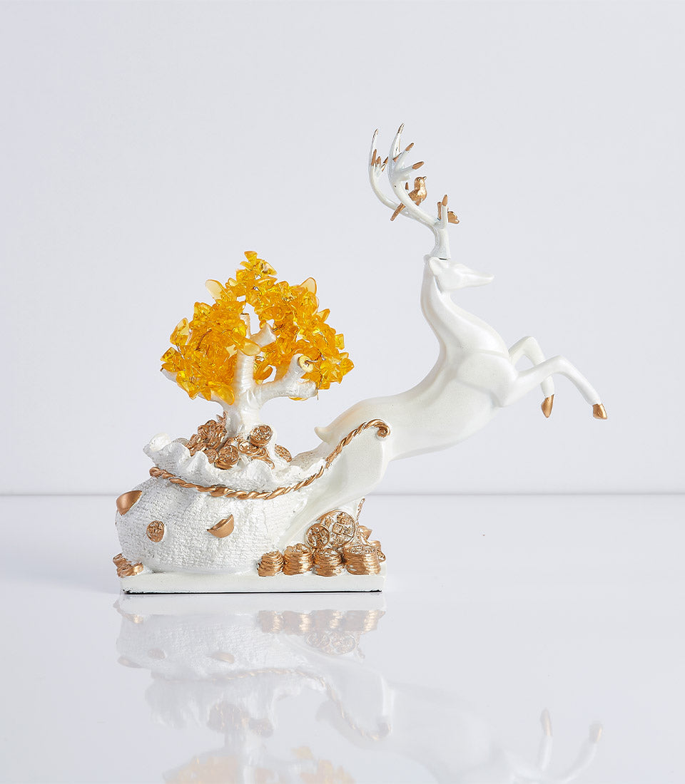 Feng Shui lucky deer leaping over white money bag with golden crystal money tree figurine