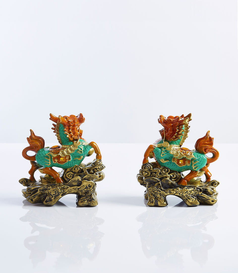 Pair of teal and gold Pixiu lucky statues with ornate dragon-horse design, perfect for new home gifting